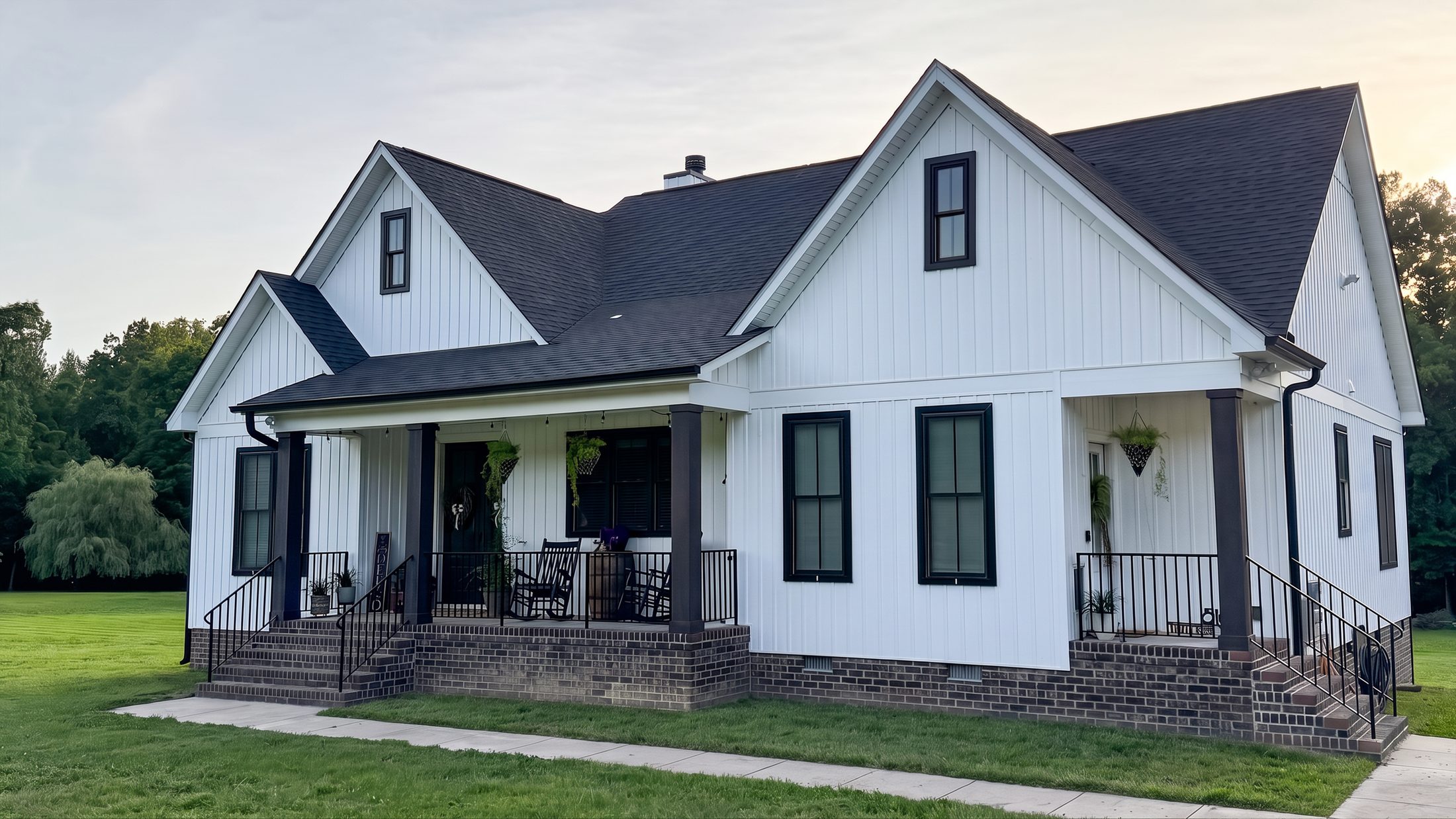 The Dorsett — a white farmhouse with black windows and a deep front porch